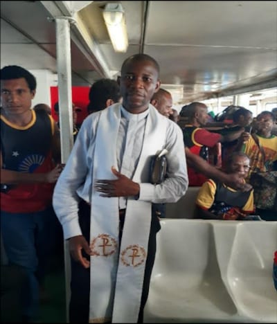 Fr George in conducting the Service in the Ship with sailors - Diocese of Aitape - Spiritans Oceania